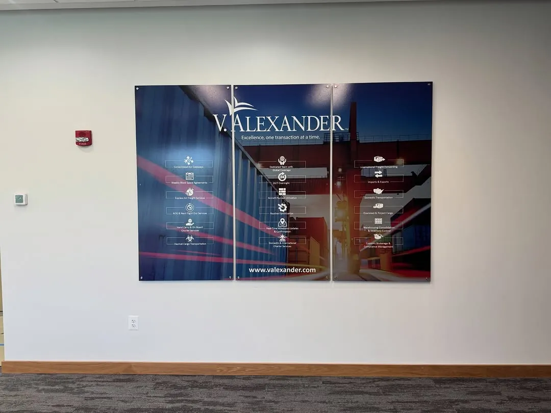 Large printed navy wall panels installed flush in a corporate lobby